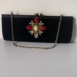 Vintage 1960s black velvet evening clutch.